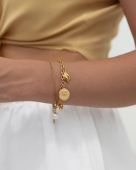 złota bransoletka z charmsami